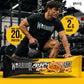 Warrior Crunch Soft Core Banoffee Pie protein bar wrapper on a gym floor, with a man in Warrior kit holding a kettlebell behind it and callouts for more than 20g protein and less than 2g sugar.