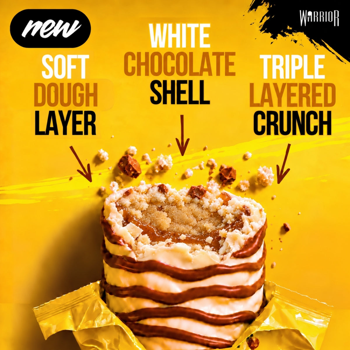 Warrior Crunch Banoffee Pie protein bar, cut open to show the soft dough layer, white chocolate shell and triple-layered crunch with a caramel centre, wrapper partially peeled back on a yellow background with biscuit crumb pieces.