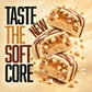 Warrior Crunch White Chocolate protein bars, three pieces cut open to show the soft dough and caramel centre with white chocolate pieces, alongside the tagline 'Taste the New Soft Core'.