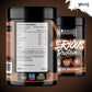 Two black plastic tubs of Warrior Serious Protein Chocolate Milkshake powder, showing the front and back labels against a dark brown background.