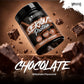A tub of Warrior Serious Protein Chocolate Milkshake flavor protein powder floating diagonally over a dark chocolate background with floating chocolate chunks and large 'CHOCOLATE' text at the bottom.