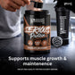 Warrior Serious Protein Chocolate Milkshake, 500g – hand adding a scoop of powder to the tub, with a matching shaker bottle and mixing ball on a dark countertop.
